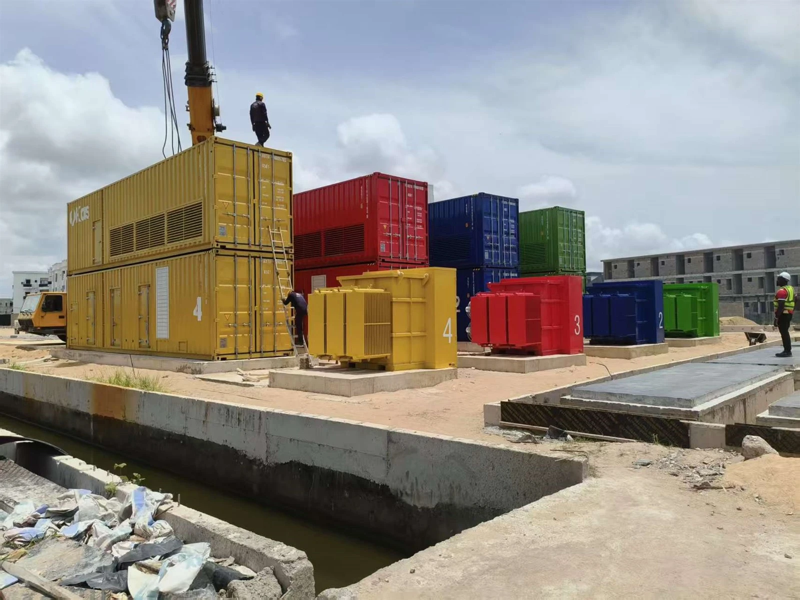 Workers installing containerized diesel generators at the Nigeria data center Workers installing containerized diesel generators at the Nigeria data center
